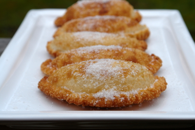 Fried empanadas stuffed with cheese and onions