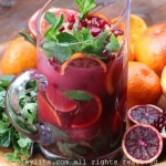 Mojito o coctel con naranja sanguinea y granada
