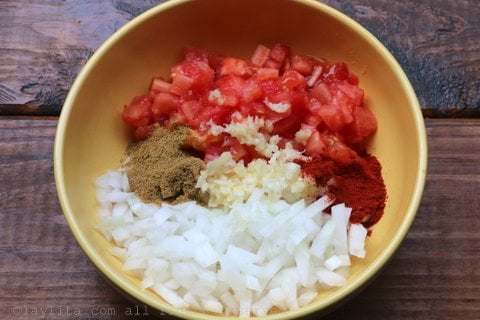 Diced onion, crushed garlic, cumin, achiote or annatto, and tomatoes for the soup's refrito