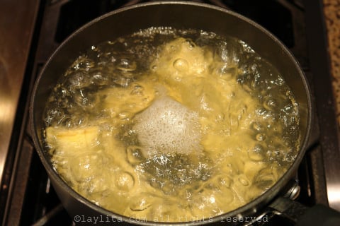 Boil the green plantains until tender