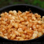 Hominy corn with roasted pork sauce
