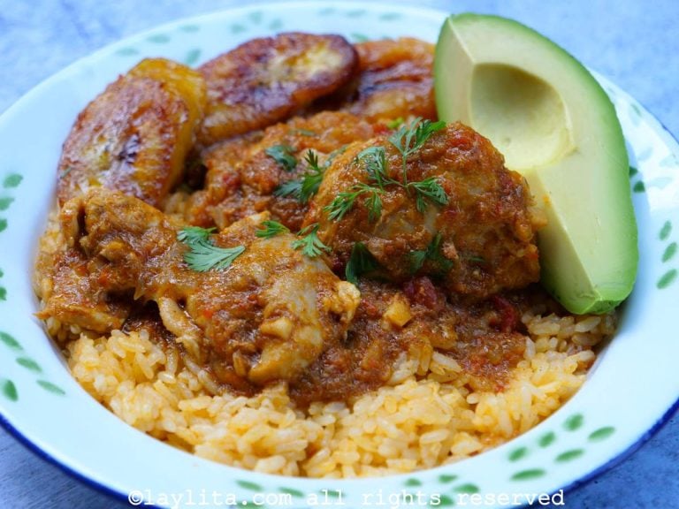 Ecuadorian chicken stew with yellow achiote rice, fried ripe plantains and avocado