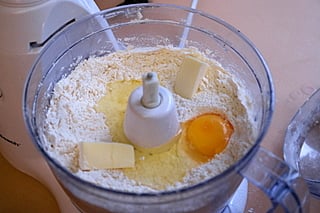 Add the butter, egg and water to the flour to make the empanada dough