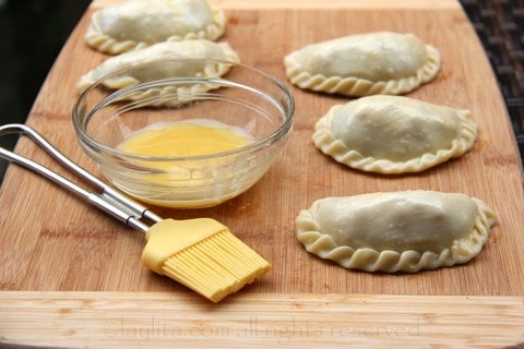 For a golden glow, brush the empanadas with egg wash before baking