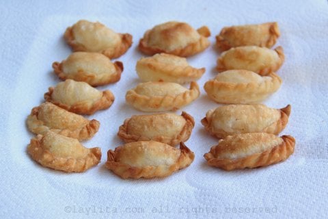 Place the fried empanadas on paper towels to remove excess oil