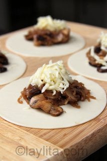 Making mushroom and cheese empanadas Making mushroom and cheese empanadas