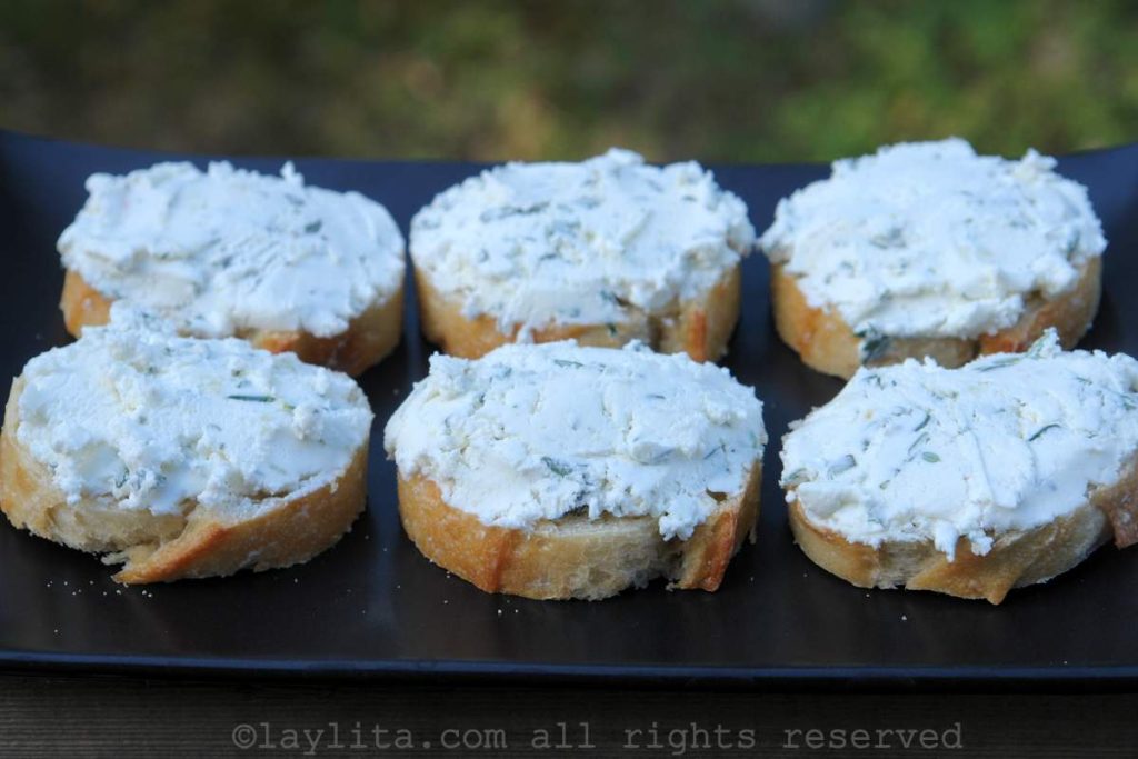 Baguette slices with garlic herb goat cheese