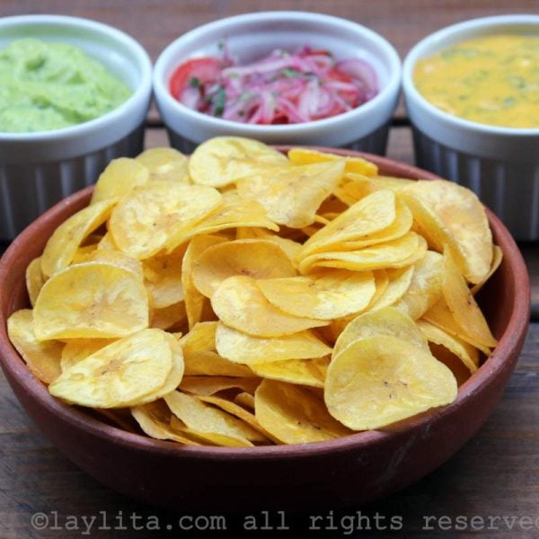 Homemade chifles or thin fried green plantain chips with dipping sauces