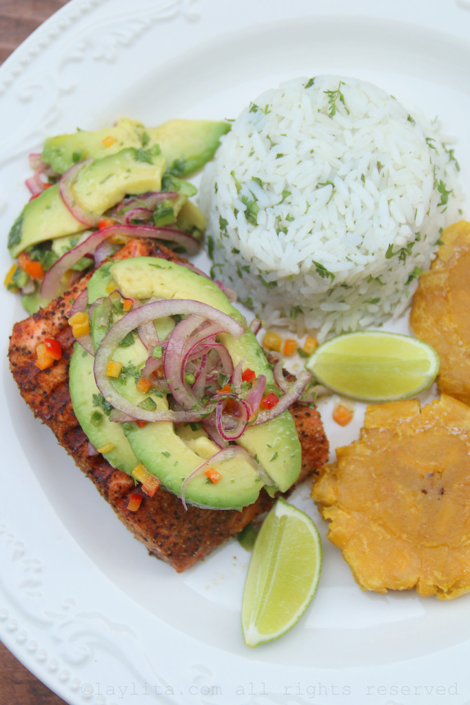 Grilled salmon with avocado salsa, cilantro lime rice, and patacones/tostones