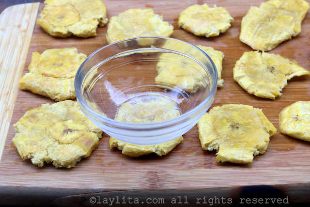 You can use the bottom of a bowl to flatten the fried plantain chips