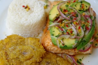 Grilled salmon with avocado salsa, rice and patacones