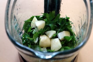 Blend the parsley with the lemon juice and garlic