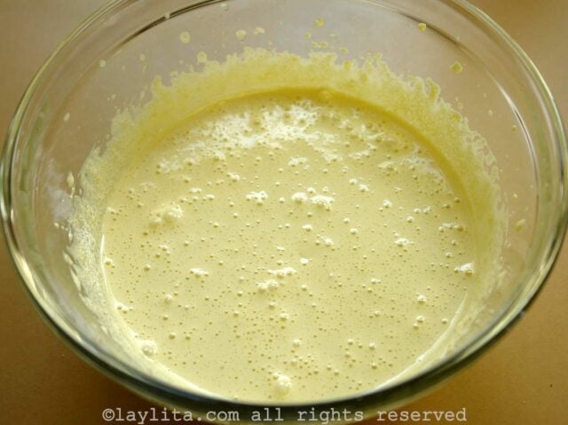 In a medium size bowl beat the egg yolks until foamy, add the sugar and the rum.