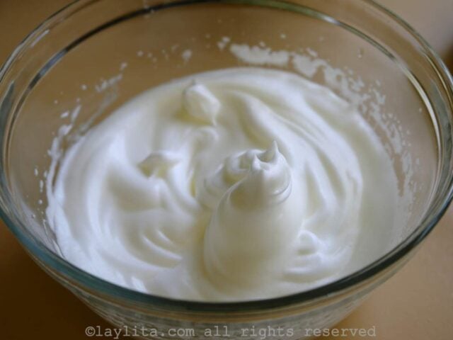 In another bowl beat the egg whites until they become fluffy and stiff