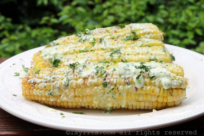 Grilled corn on the cob with queso fresco cilantro sauce