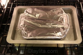 Cover with foil and bake in an oven bath at 425F