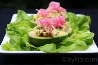 Avocados filled with egg salad and pickled onions