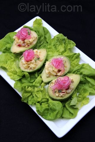 Egg salad stuffed avocados with pickled onions