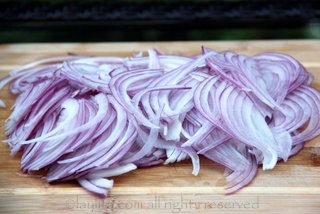Slice the red onion very thinly and then rinse in cold water with some salt