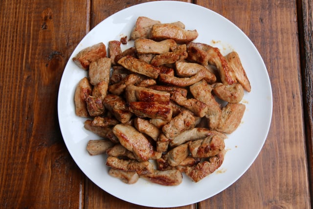 Save the cooked pork tenderloin strips on a warm plate