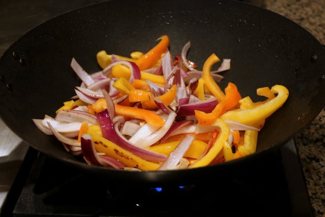 Cook the onions, peppers and garlic over high heat for about 5-7 minutes