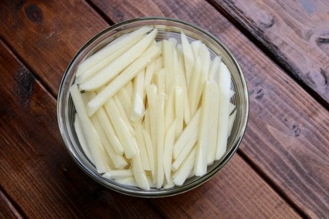For the fries: Soak the potato strips in cold water