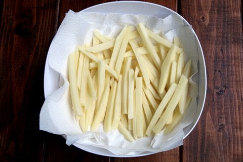 Next drain the potato strips and dry them well