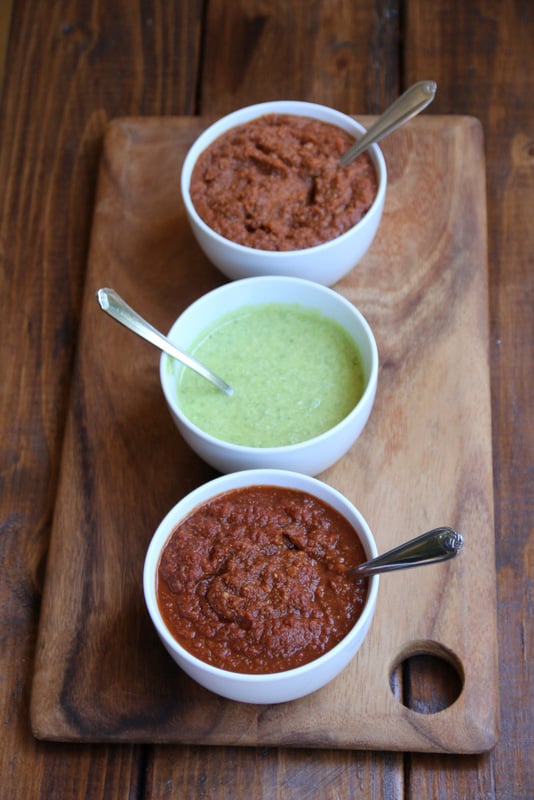 Sauces for Mexican tortilla pizzas: spicy tomato sauce, garlic jalapeño parmesan, and refried bean sauce