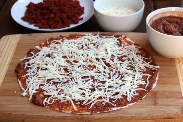Sprinkle some grated parmesan and shredded mozzarella