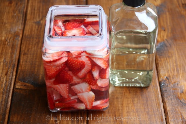 Pour the tequila over the strawberries