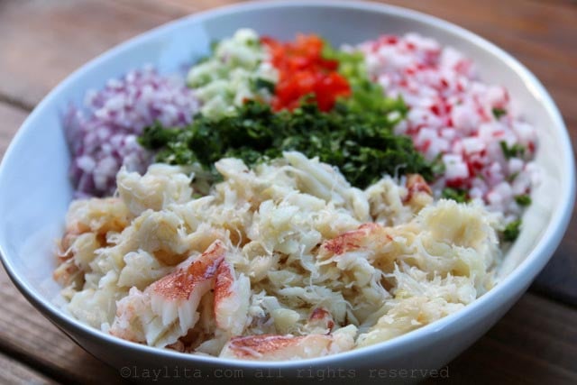 Place the ingredients for the crab salad in a bowl