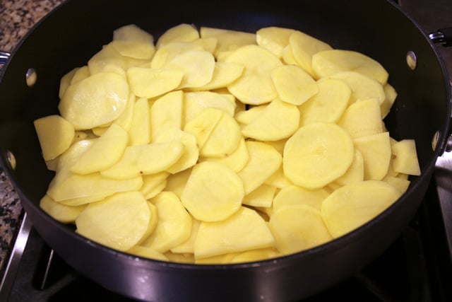 Heat the oil and cook the potatoes for about 5 minutes