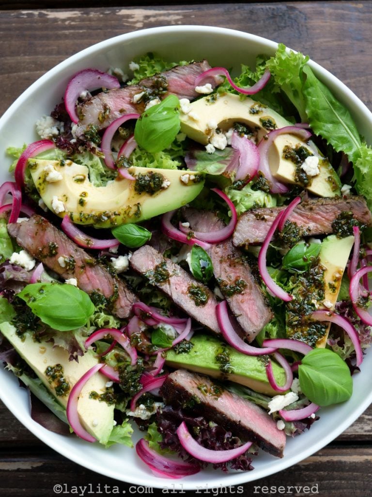 Leftover grilled steak salad with avocado, blue cheese, onions, and balsamic dressing