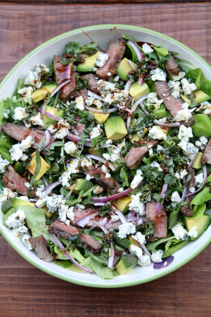 Steak salad with blue cheese, avocado, and basil balsamic dressing