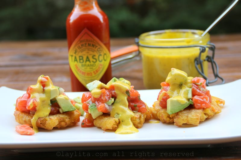 Plantain chips or tostones patacones with salmon tartare and mango habanero sauce