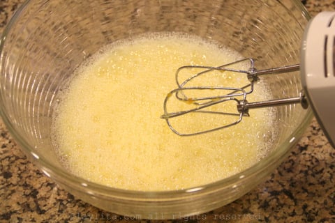 Beat the eggs and sugar with an electric mixer
