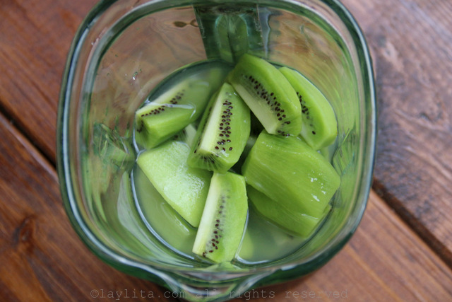 Blend the kiwis with sugar or honey, lime juice, and water