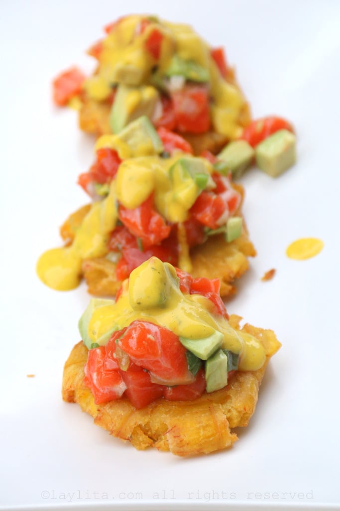 Patacones or tostones topped with salmon avocado tartare