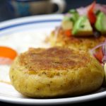 Green plantain cakes or patties filled with cheese