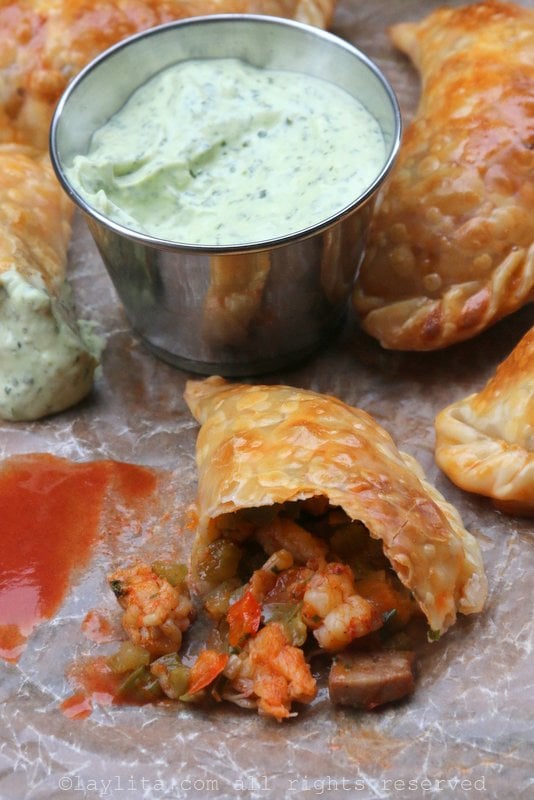 Langostino and Andouille sausage empanadas with avocado dipping sauce