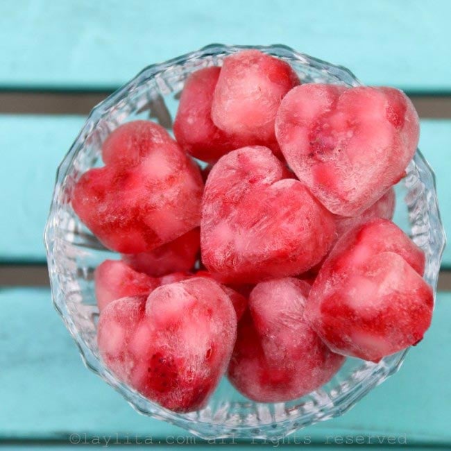 Heart ice cubes made with champagne and strawberries