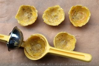 Use a lemon squeezer to shape the plantain chips into plantain cups