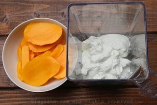 Mango slices and yogurt to make smoothie popsicles