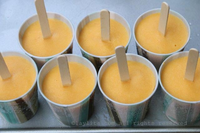 Freeze the mango yogurt popsicles until ready