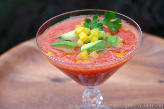 Serve the gazpacho garnished with diced pepper and avocado