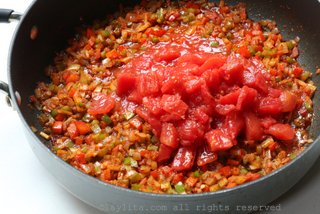Add the diced tomatoes and continue cooking