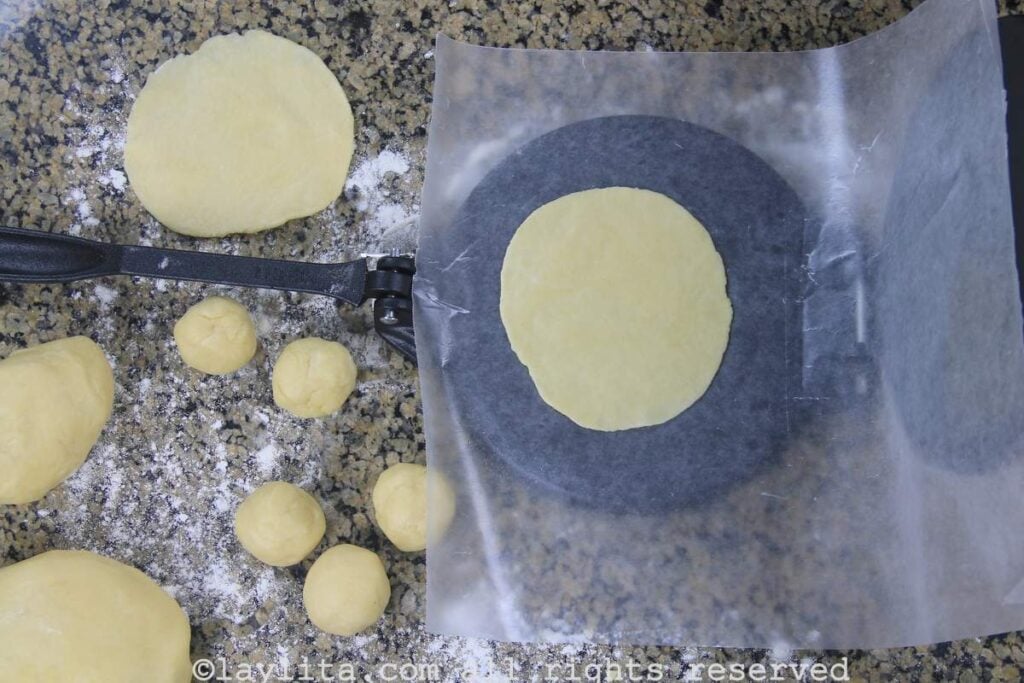 You can also use a tortilla press to make the empanada disks