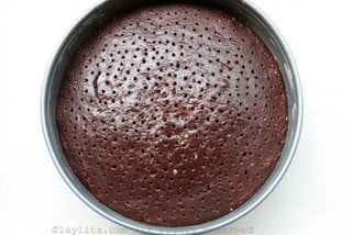 Poke several holes in the cake using a skewer