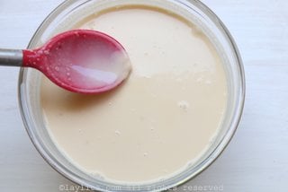 Mix the condensed milk with the evaporated milk, the cream, and the rum