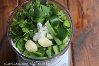 Mix the cilantro, hot peppers, garlic, green onions, and lime juice in a small food processor or blender.